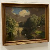 An oil on canvas signed lower right of a river bank scene