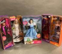 A selection of five boxed Barbies to include Halloween Glow, Enchanted Halloween, My Graduation