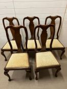 Five mahogany dining chairs