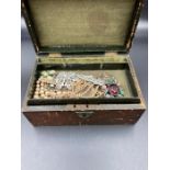 A jewellery box containing costume jewellery to include Gents cuff links as well.