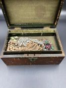 A jewellery box containing costume jewellery to include Gents cuff links as well.