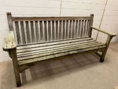 A garden wooden slatted teak bench, weathered (H91cm W188cm D70cm)