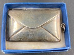 A silver, Chester hallmarked stamp holder in the form of an envelope