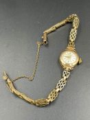 A 9ct gold ladies watch and strap by Bernex (Approximate weight 10.5g)