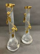 A pair of gilt bud vases