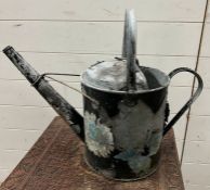 A vintage watering can