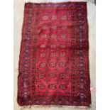 A red rug with floral pattern and geometric pattern 143cm x 96cm