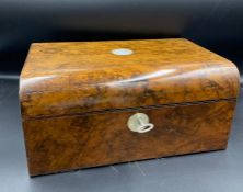 A Ladies walnut jewellery box with mother of per cartouche and lock mount.