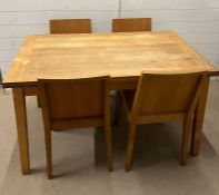 A Habitat Ruskin table extending oak with four chairs (H76cm W126cm D75cm)