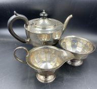A silver tea service with teapot, sugar bowl and milk jug. Hallmarked for Sheffield 1930 by Viners