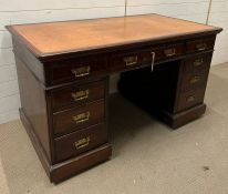 A Victorian pedestal desk, nine drawers with brass handles and leather top (H78cm W138cm D75cm)