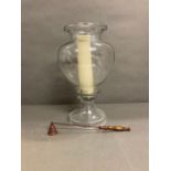 A storm lamp with candle snuffer