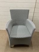 A rattan garden chair by The Original Garden Furniture