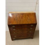 A mahogany bureau with fall front opening to drawers and writing slope. AF