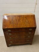 A mahogany bureau with fall front opening to drawers and writing slope. AF