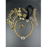 A selection of quality costume jewellery including brooches, earrings and several necklaces.