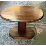 An oval side table, weighted bottom (H46cm W65cm D48cm)