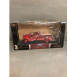 A boxed Diecast Ford 1938 fire engine