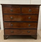 A mahogany chest of drawers on bracket feet (H109cm W106cm D54cm)