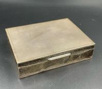 A silver cigarette box, hallmarked for Birmingham 1966 by E & N Speak 11.5 x 9 cm x 3cm H