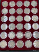 Seven trays of Great Britain coins to include, Crowns, half crowns, schillings and six pence.