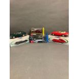 A selection of four boxed Jaguar models