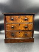 A miniature three drawer chest of drawers (H28cm W30cm D16cm)