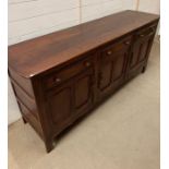 A sideboard with three drawers and cupboards under