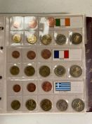 An album of euro coins, catalogued by country of issue.