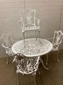 A painted metal garden table and chairs (H66cm Dia108cm)