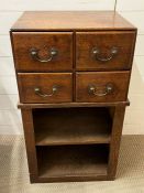 An oak four drawer secretarial card file with open shelfs below (H87cm W49cm D38cm)