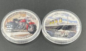 Two American 1 oz silver dollars celebrating Harley Davidson and Titanic