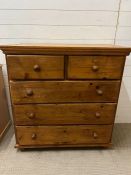 A three over two pine chest of drawers (H95cm W91cm D47cm)