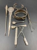 A selection of silver curios to include cocktail stirrer, button hook, bracelet etc