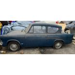 A Ford Anglia classic car 1964 saloon with the rare small grill front, 997cc, petrol, in blue.