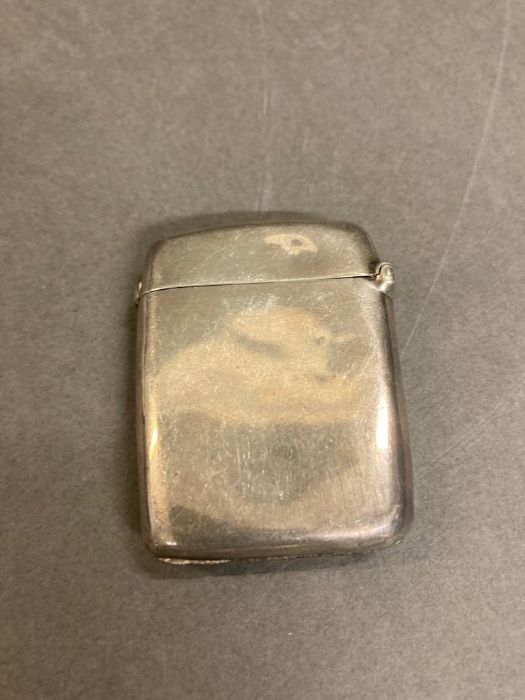 A silver vesta case, hallmarked for London 1897 by W H Webber & Co