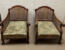 A pair of bergère armchairs in regency style