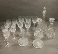 A selection of various cut glass to include, wine glasses and decanters