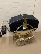 An 1950's double hood pram (H93cm W103cm D39cm)