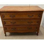 An oak three drawer chest of drawers (H80cm W105cm D47cm)