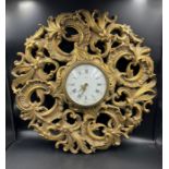 A Jaegar wall clock in golden plastic case with floral decoration (Dia 56cm)