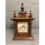 A walnut mantel clock