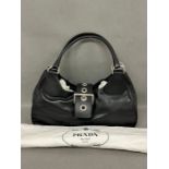 A Prada black leather Vitello Moon saddlebag with dust cover and authenticity card (W40cm)