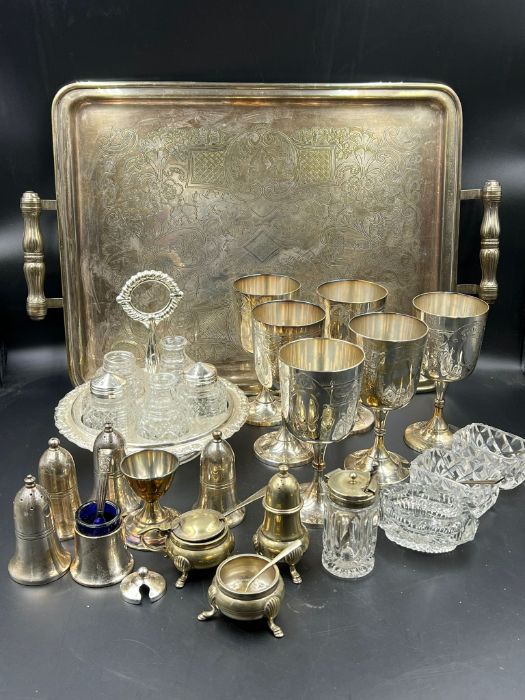 A selection of silver plated items to include trays, salts and goblets