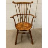 A stick back Windsor armchair (H104cm W60cm D21cm)