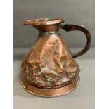 A vintage copper jug