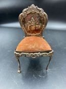 An ornate silver pin cushion in the form of a chair, hallmarked for London 1901, makers mark W.C
