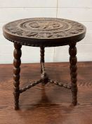 An oak carved circular table on bobbin tripod legs (H57cm Dia45cm)