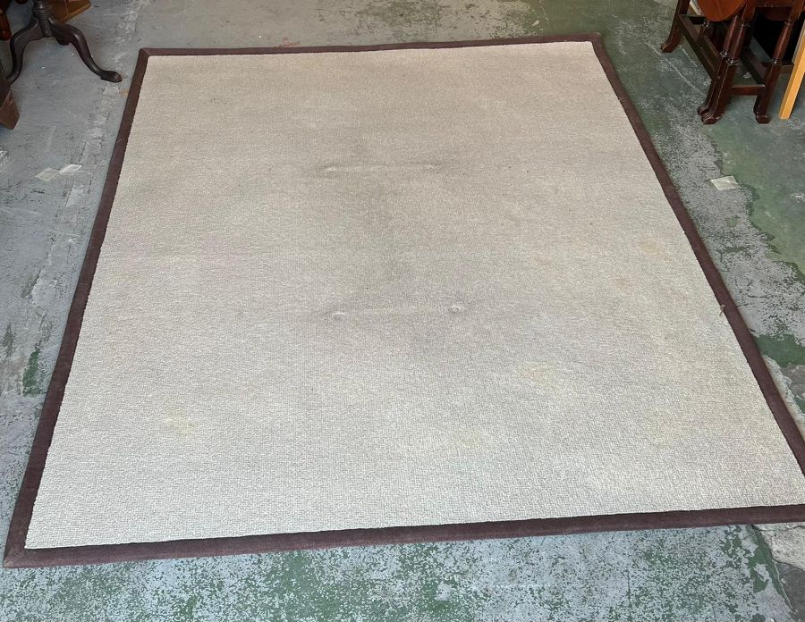 A cream natural fibre rug (222cm x 275cm)
