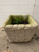 A square planter in the form of a stones